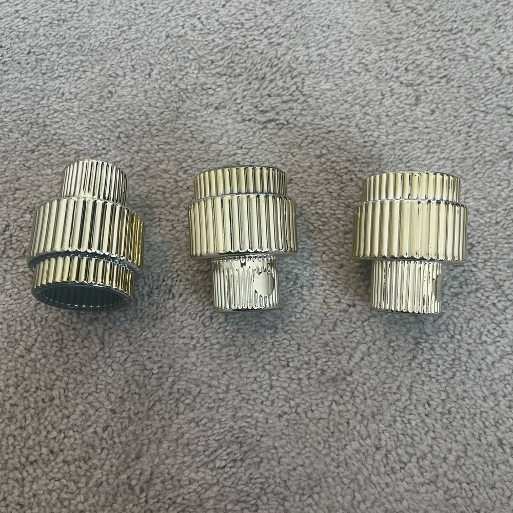 Set of 3 gold tone candle holders